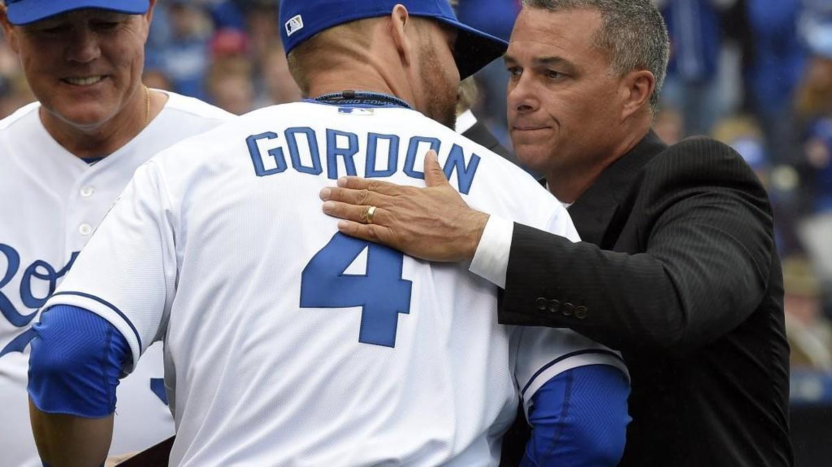 Kansas City Royals left fielder Alex Gordon got a hug from Royals general manager Dayton Moore at the ALCS ring ceremony in April at Kauffman Stadium.