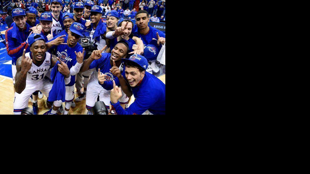 The Kansas Jayhawks celebrate winning their 11th straight Big 12 Conference title with a 76-69 overtime win over West Virginia at Allen Fieldhouse.