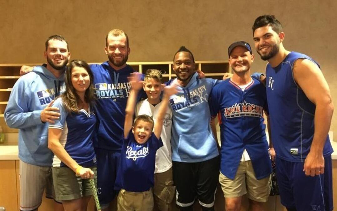 The Schwab family: Michelle (second from left), Alex (center foreground), Nathan (center background) and Scott (second from right) met Royals players including Mike Moustakas, Danny Duffy, Jarrod Dyson and Eric Hosmer in August.