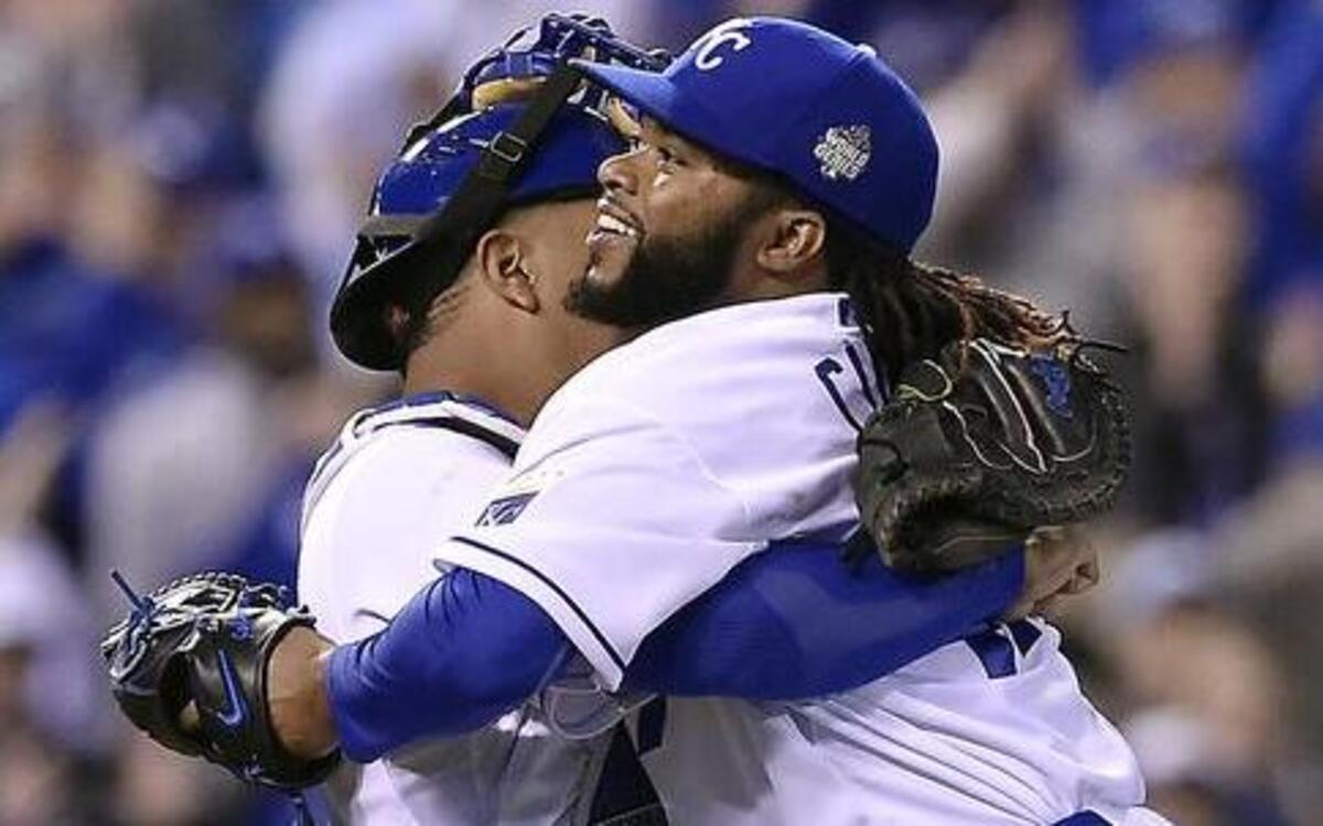 Royals catcher Salvador Perez (left) embraced teammate Johnny Cueto after Cueto completed his two-hitter against the Mets Wednesday night at Kauffman Stadium.
