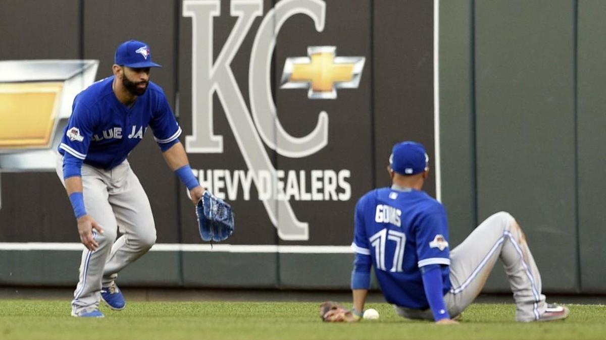 
Blue Jays second baseman Ryan Goins (on ground) and right fielder Jose Bautista got tripped up by Ben Zobrist’s shallow fly to right on Saturday; neither made a catch that one of them should’ve made.
