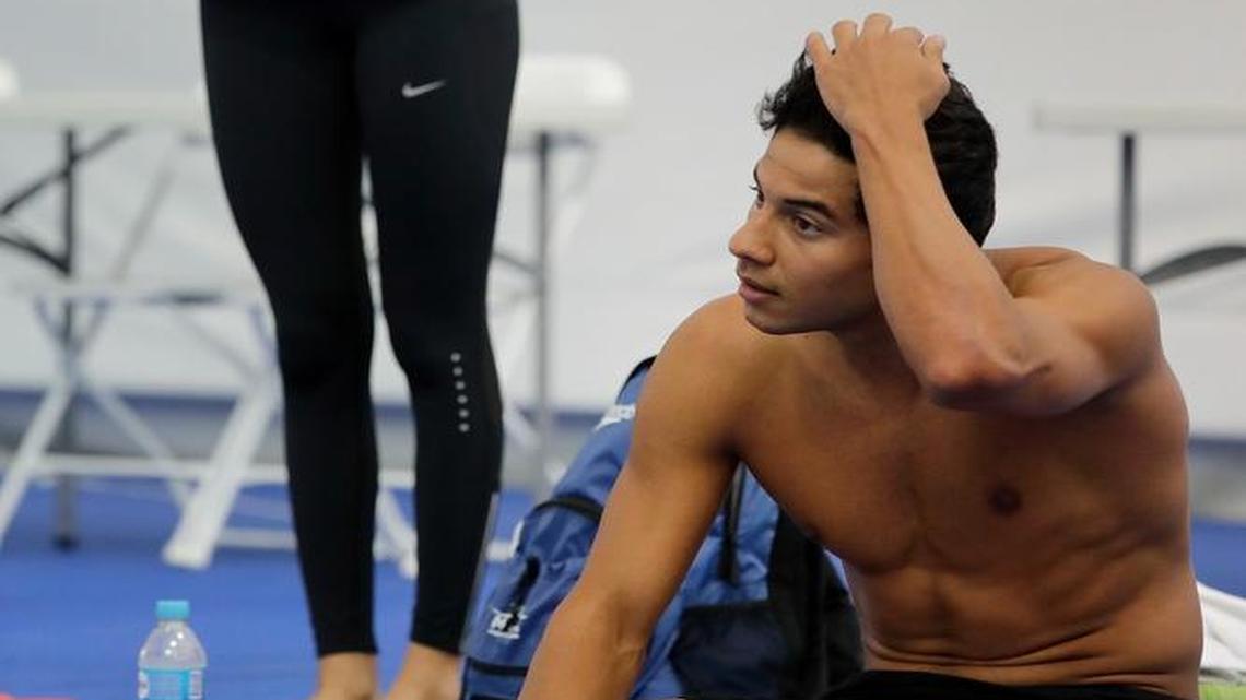 Rami Anis (right) and Yusra Mardini are swimmers on the Olympic refugee team. Both made treacherous journeys to flee Syria.
