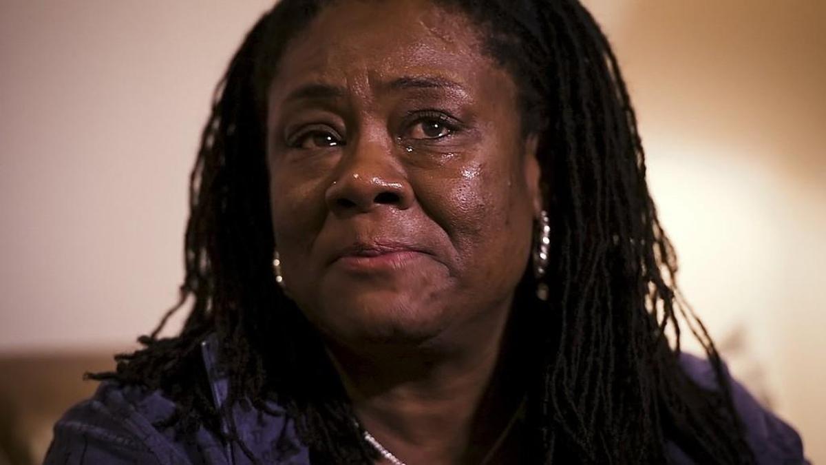 Mia Spiller, of Austin, has been a second mother and caretaker for Robbie Morse for the past 19 years. She cried as she spoke of the love she receives from Robbie, who is severly disabled.