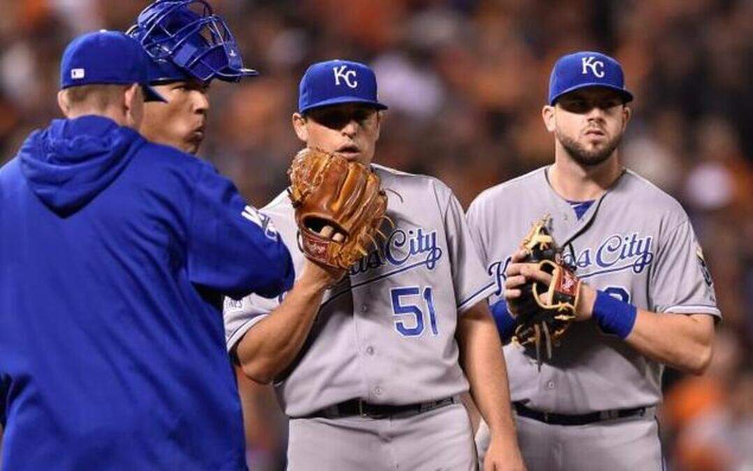 
Jason Vargas (second from right) talked things over during a visit on the mound in the third inning.


