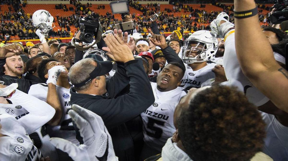 Missouri coach Gary Pinkel was in the middle of a happy group of players after a 20-16 win over BYU on Saturday at Arrowhead Stadium.
