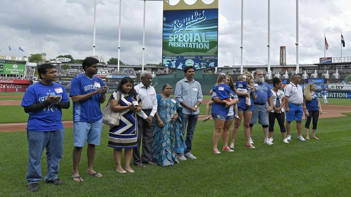 The Kansas City Royals honored Alok Madasani (left), a survivor from the shooting at Austins Bar & Grill in Olathe, and the family of victim Srinivas Kuchibhotla before Sunday’s game at Kauffman Stadium.