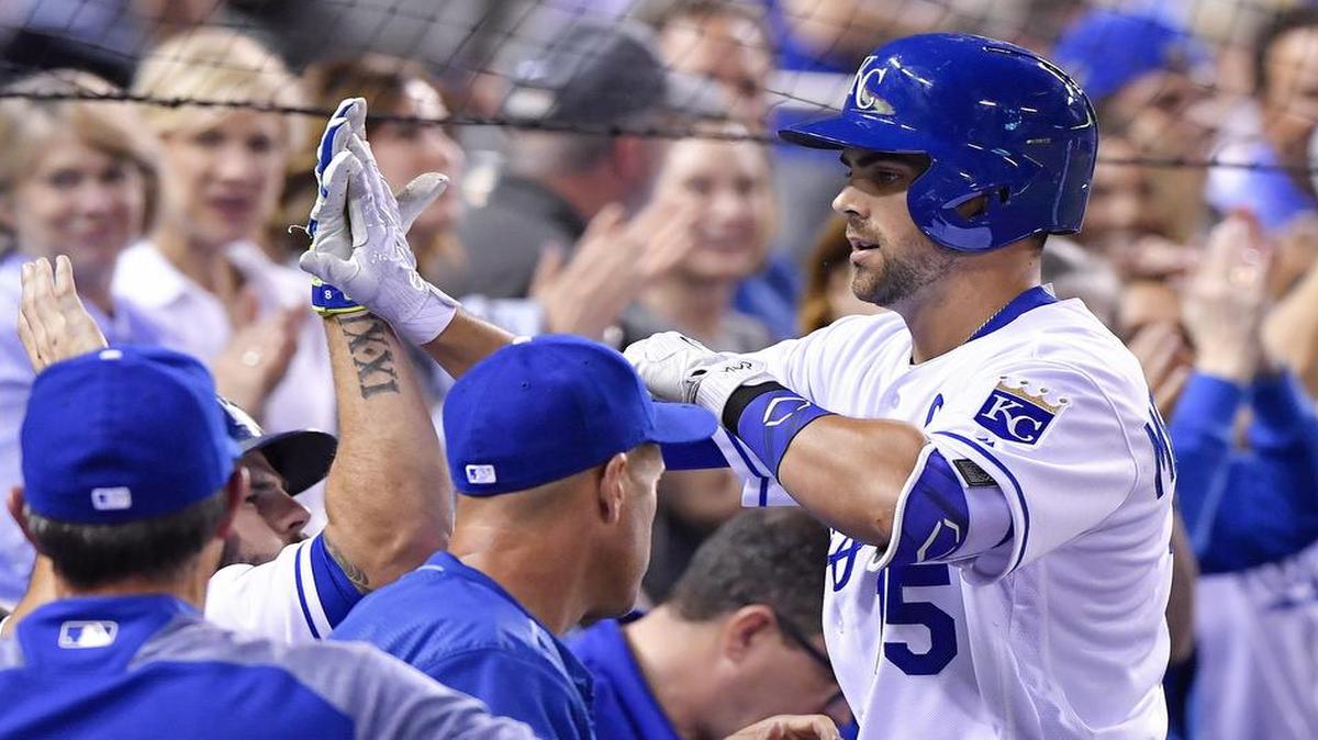The Royals’ Whit Merrifield was congratulated by his teammates after he hit a solo home run in the fifth inning of Tuesday’s game against the San Francisco Giants at Kauffman Stadium. Merrifield’s homer provided the Royals’ only run in a 2-1 loss in 11 innings.