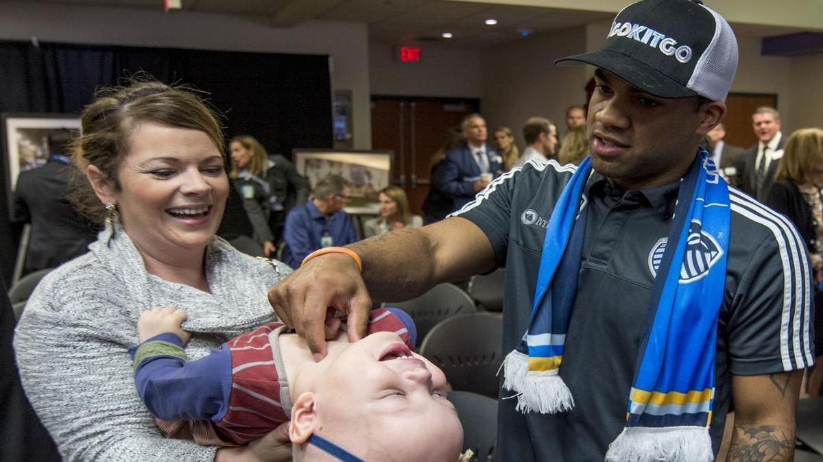 Sporting Kansas City defender Kevin Ellis (right) has become friends with Mary Kate Van Sickle and her daughter Kit Van Sickle, who was diagnosed with acute lymphoblastic leukemia in February. That friendship was one of many factors that led to a partnership with Sporting and Children’s Mercy Hospital.