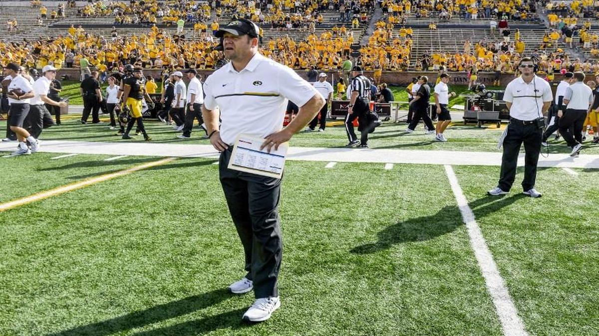 In front of a sparsely filled Memorial Stadium, Missouri Tigers head coach Barry Odom watched the coin toss before the start of the college football game on Saturday, Oct. 28, 2016, in Columbia on Faurot Field. The Kentucky Wildcats defeated the Missouri Tigers 35-21.