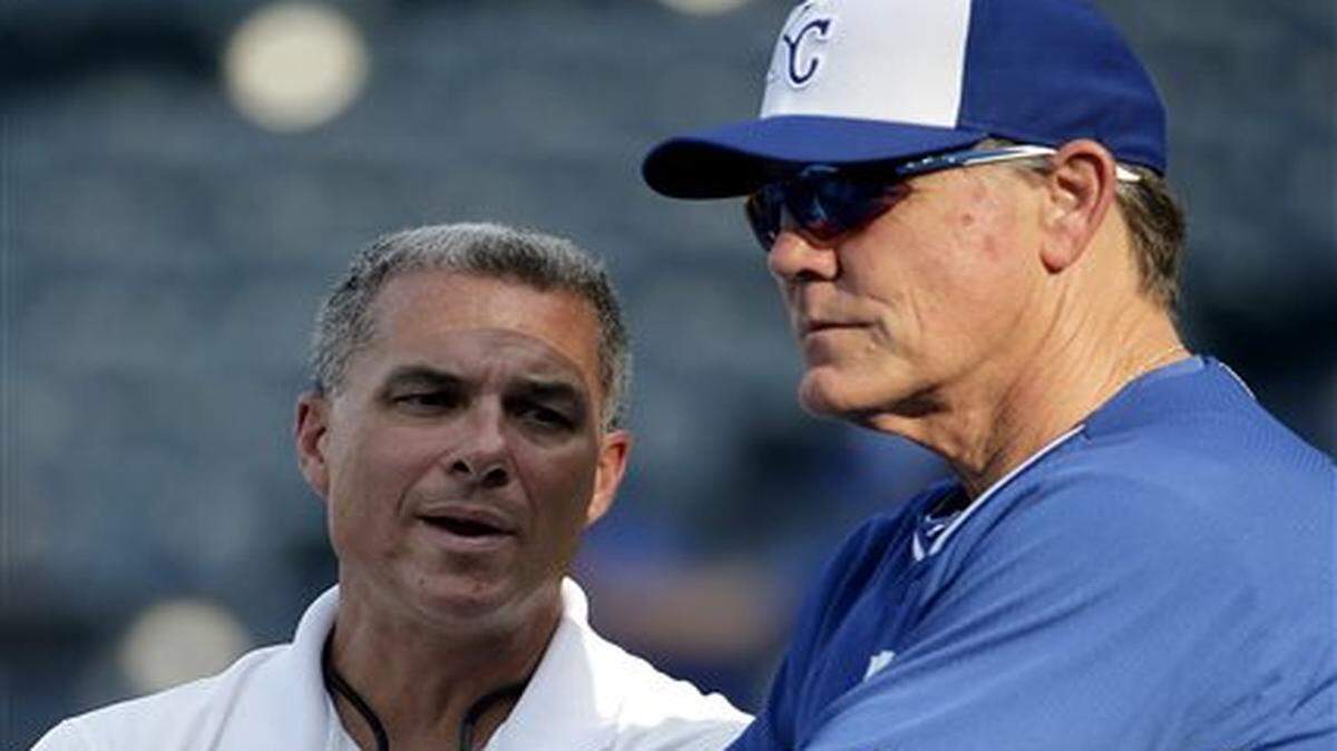 
Kansas City Royals manager Ned Yost and general manager Dayton Moore talk during batting practice before a game against the Cleveland Indians on Sunday.
