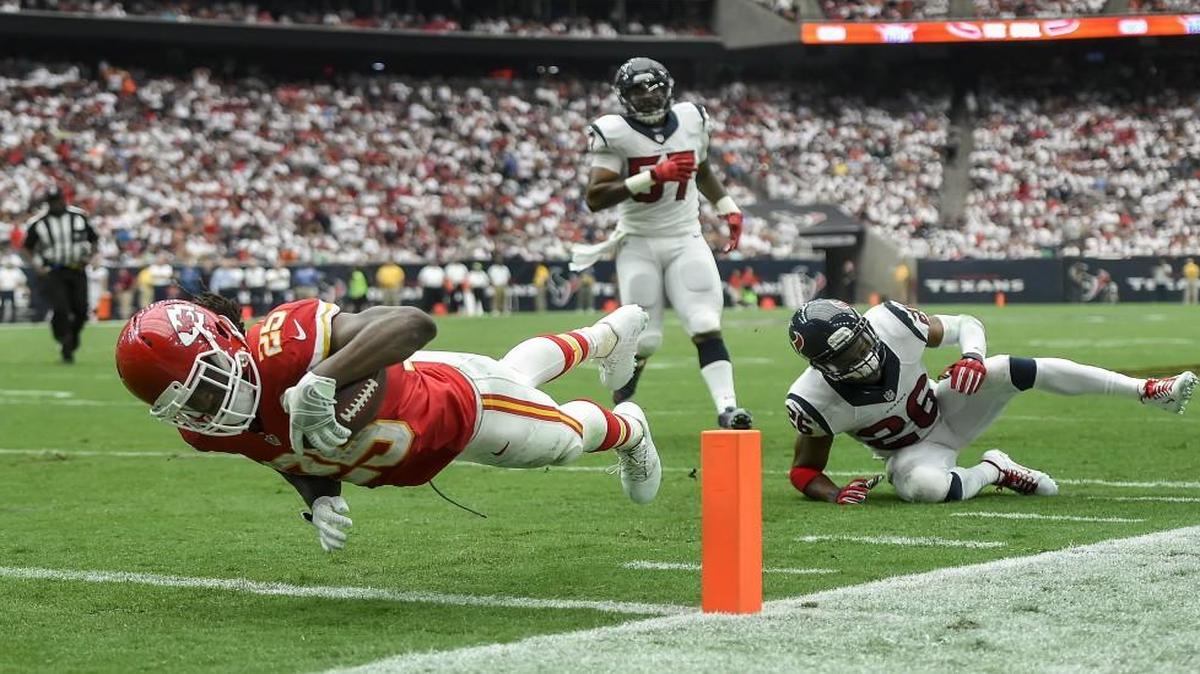 Chiefs running back Jamaal Charles (25) dove into the end zone in the second quarter past Texans defensive back Rahim Moore (26) on Sept. 13, 2015 at NRG Stadium in Houston.