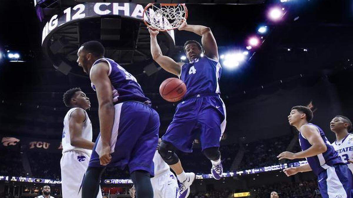 
TCU’s Amric Fields threw down a two-handed dunk, much to the delight of teammate Trey Zeigler during the second half of Wednesday’s Big 12 Tournament game at the Sprint Center. TCU won, 67-65.
