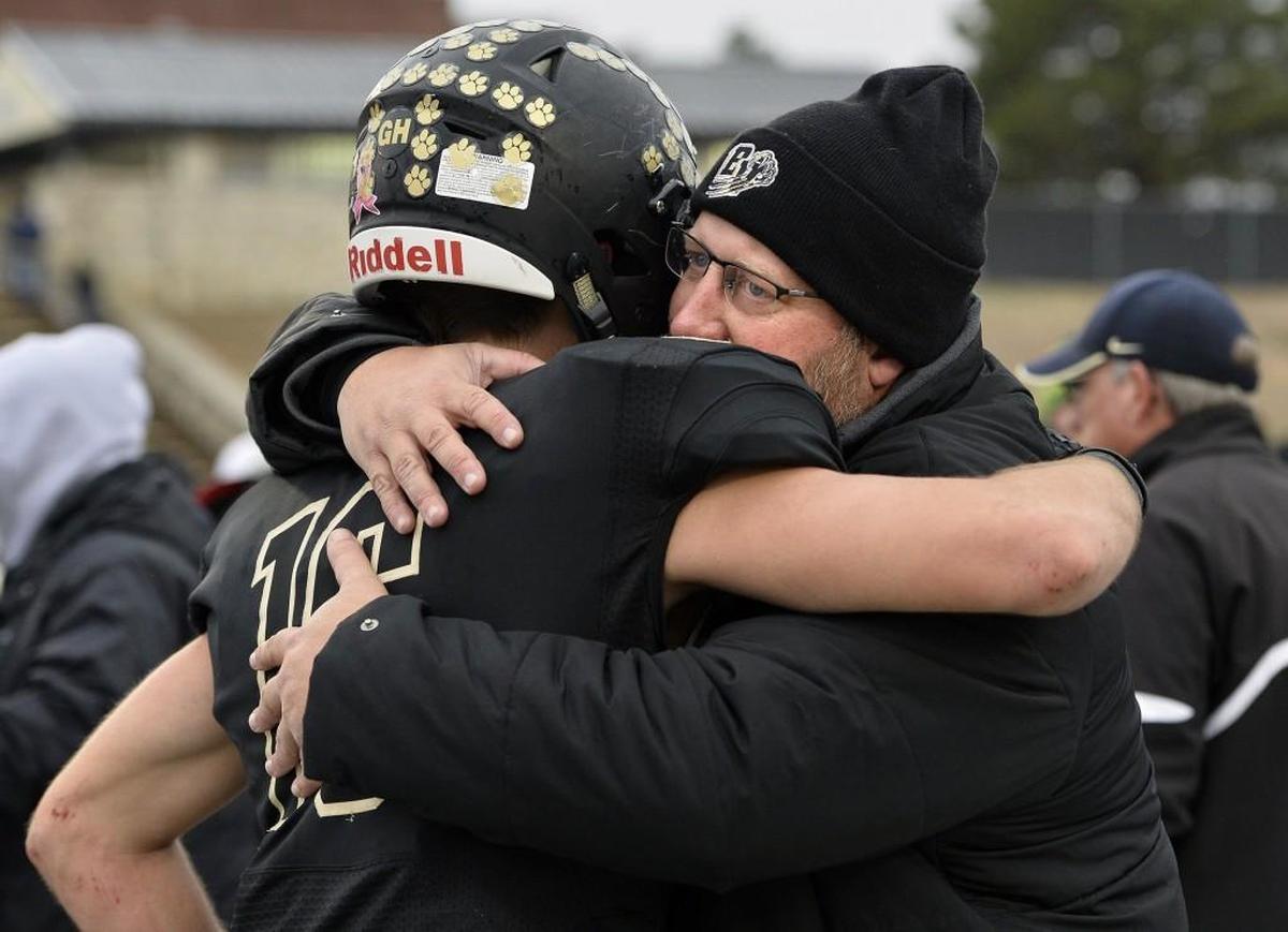 As head football coach at Blue Valley High, Eric Driskell, right, shared a special bond with players, students and others throughout the school community.
