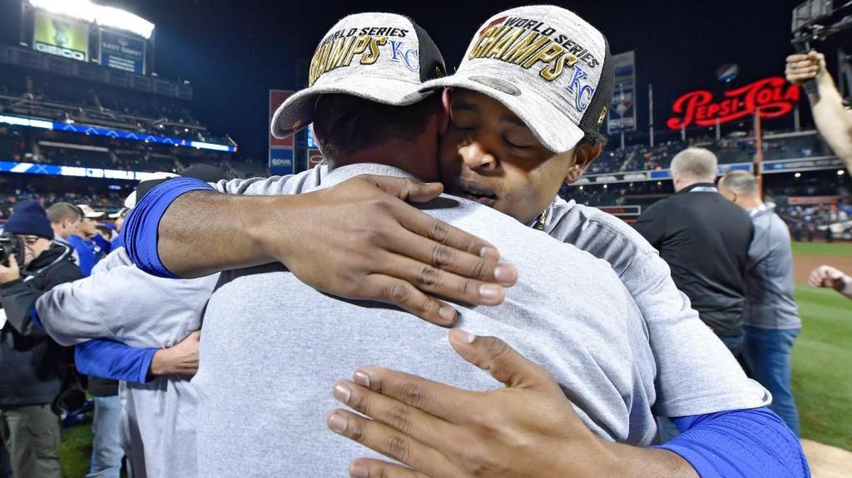 Pitcher Edinson Volquez (right) gets a hug from a teammate after the Royals’ Series-clinching win at Citi Field.