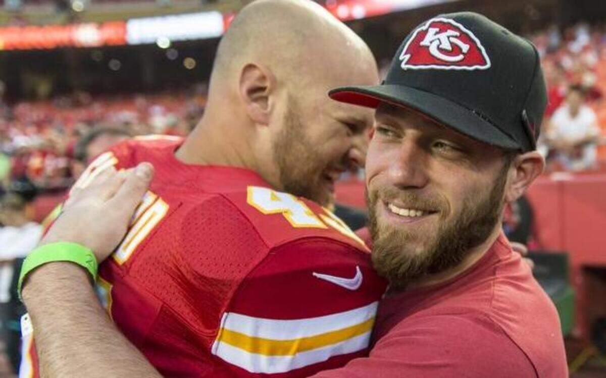 
Kansas City Royals closer Greg Holland hugged Kansas City Chiefs long snapper Thomas Gafford before the game between the Chiefs and the New England Patriots at Arrowhead Stadium on Sept. 29.
