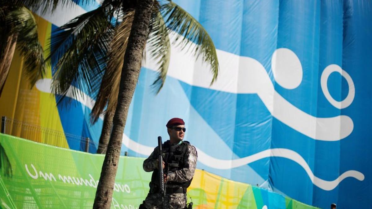 A National Security Force officer patrolled outside the beach volleyball arena along Copacabana Beach just prior to the start of the 2016 Summer Olympics in Rio.