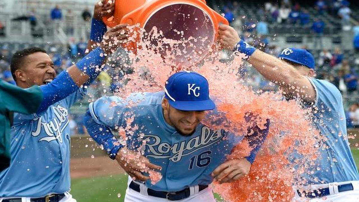 Rookie left fielder Paulo Orlando got a Gatorade shower from Salvador Perez (left) and Erik Kratz after a 4-1 win over the White Sox on Thursday.