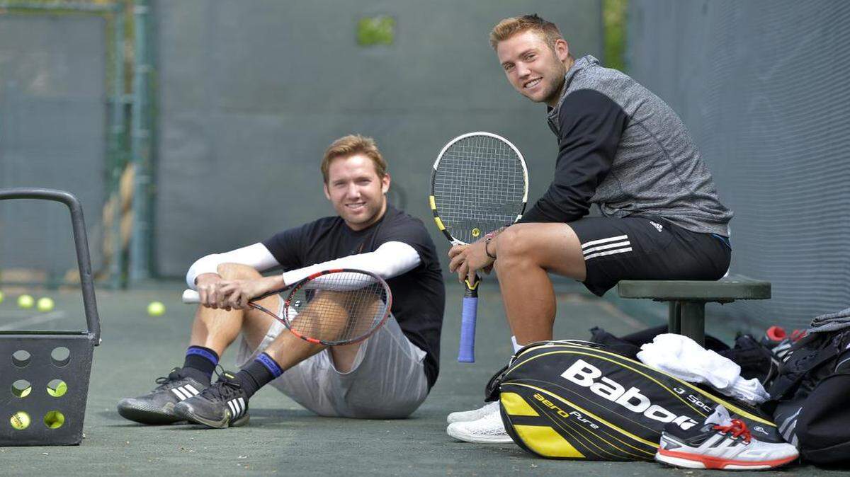 
Jack Sock (right), who recently won his first ATP singles championship, and his brother Eric (left) took a break during a workout at the Carriage Club in Kansas City, Mo.
