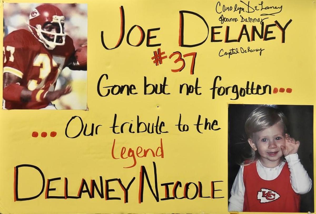 Mark and Kelly Neath named their daughter after Joe Delaney, a running back for the Kansas City Chiefs who died trying to save three children in Louisiana in 1983. This is the sign Joe Delaney’s widow, Carolyn Delaney, spotted before taking a photo with Mark.