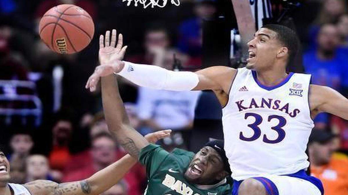 
KU’s Landen Lucas swatted away a shot by Baylor’s Royce O'Neale in the second half of Friday’s Big 12 Tournament semifinal game at the Sprint Center.
