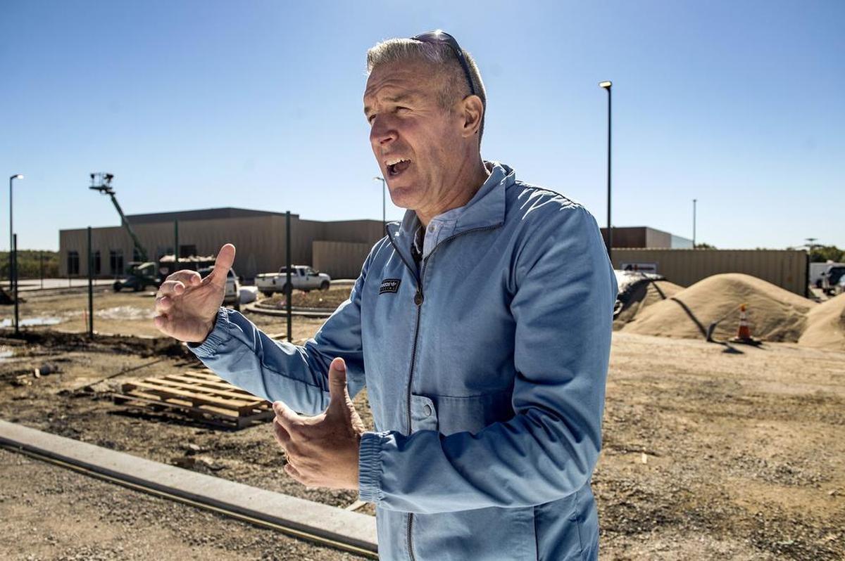 Sporting Kansas City coach Peter Vermes talked near the main building at the National Training and Coaching Development Center in Kansas City, Kan. The $80 million facility, expected to open in December, will provide a permanent home for Sporting Kansas City and a coaching education center for U.S. Soccer.