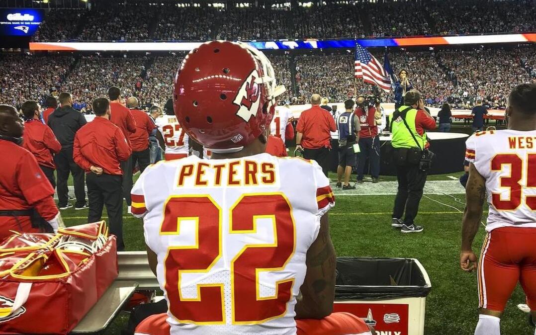 Chiefs cornerback Marcus Peters sat on a trainer’s bench during the national anthem prior to season opener against the New England Patriots on September 7, 2017 at Gillette Stadium.