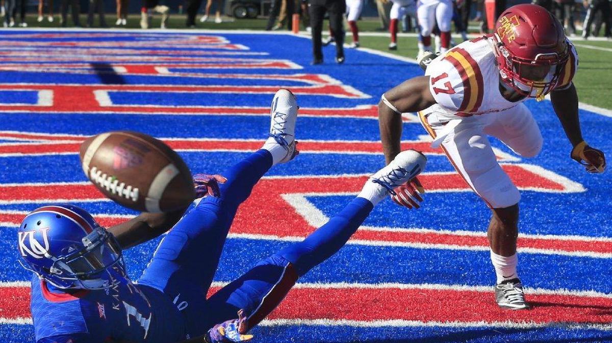 Iowa State defensive back Jomal Wiltz (right) broke up a pass intended for Kansas wide receiver Steven Sims Jr. in the end zone during the first half of Saturday’s game in Lawrence.