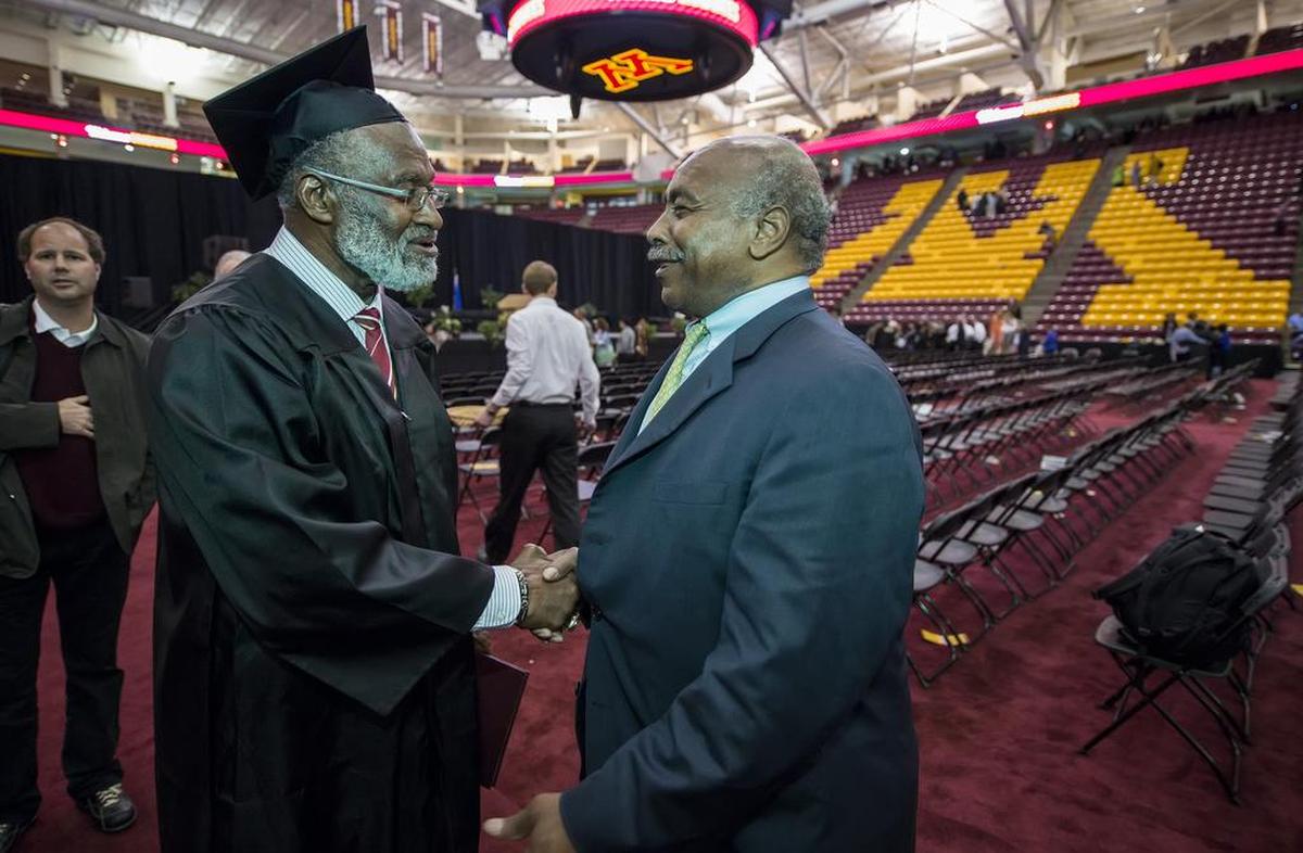 Bobby Bell (left) was joined by former Chiefs teammate Willie Lanier at the graduation festivities. Lanier flew in from Virginia for the event.