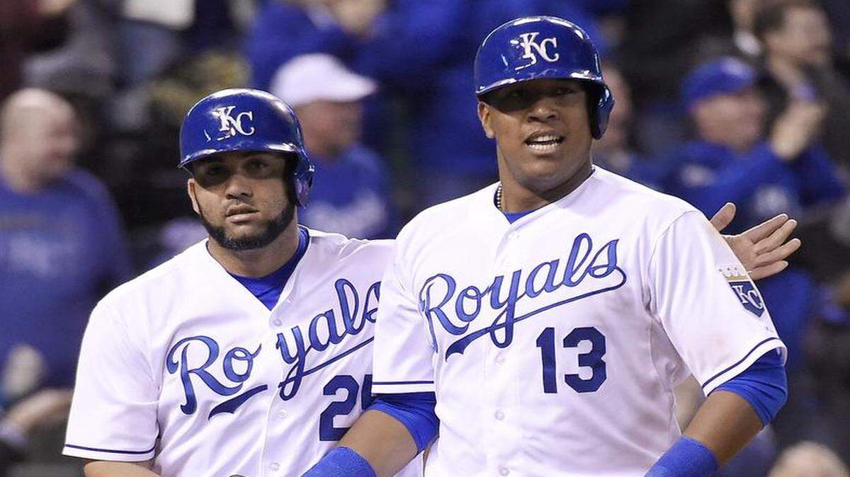 
The Royals’ Kendrys Morales (left) and Salvador Perez celebrated after scoring on a triple by Paulo Orlando in the eighth inning of Monday’s game against the Twins at Kauffman Stadium.
