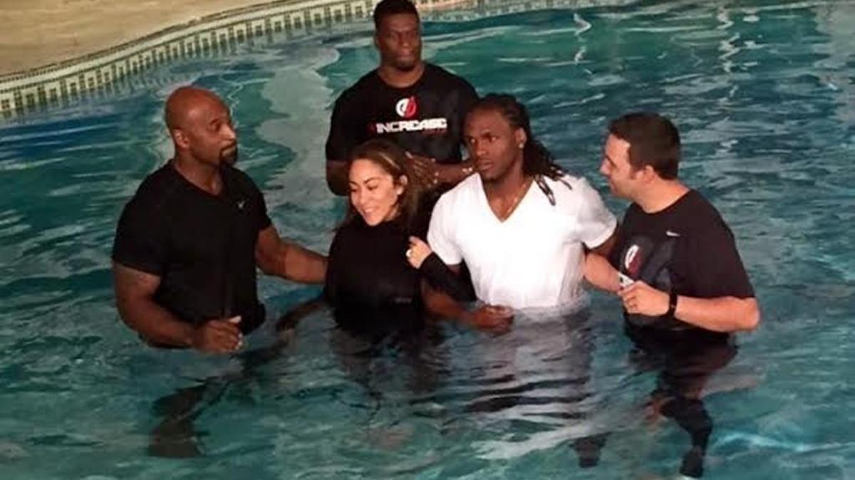 Jamaal Charles (in white T-shirt) and his wife, Whitney, were baptized together during the offseason in Colorado.