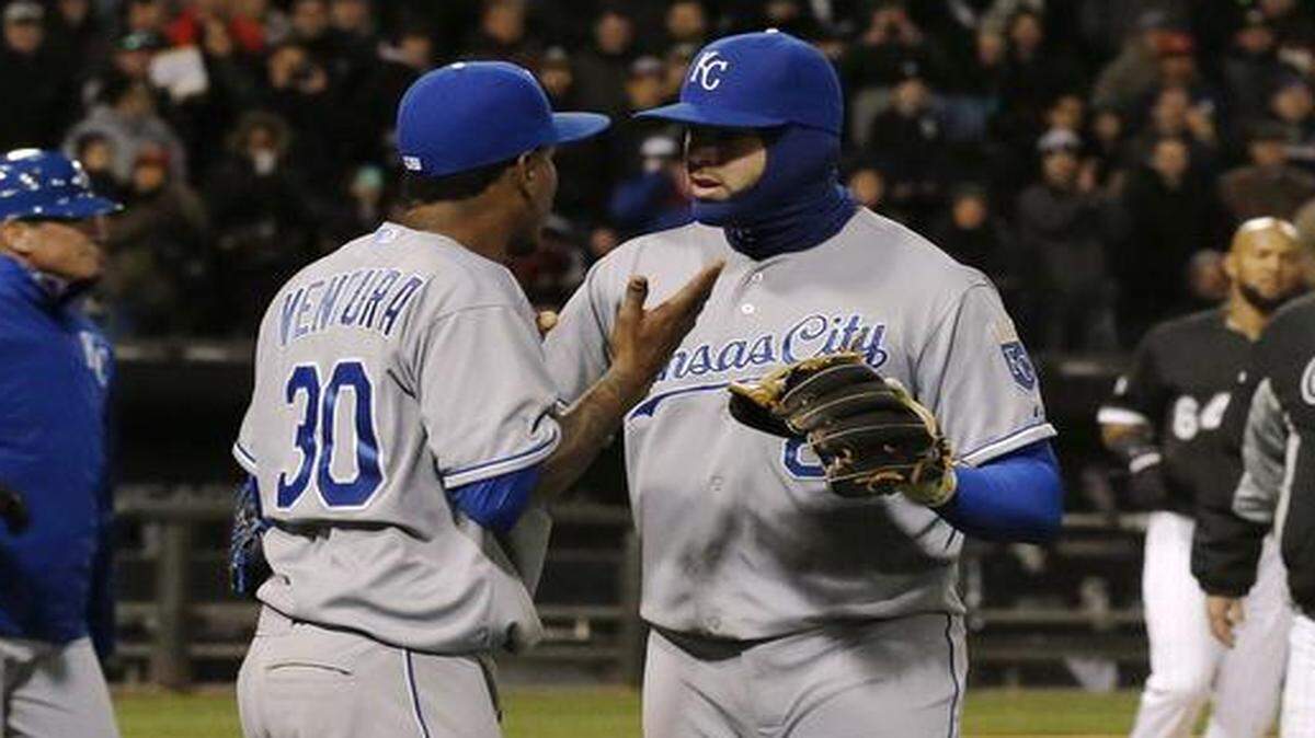 
Royals starting pitcher Yordano Ventura (left) had to be pulled aside by teammate Mike Moustakas after benches cleared during the seventh inning Thursday in Chicago. Ventura was later ejected and the Royals beat the White Sox 3-2 in 13 innings.
