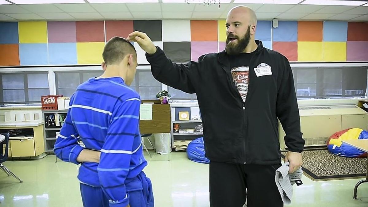 Mitch Morse, right, playfully compares hairstyles with his younger brother, Robbie.