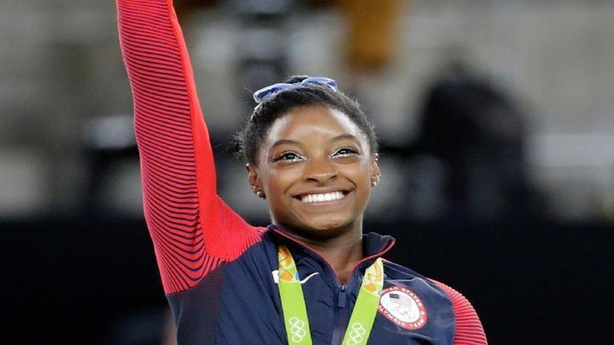 The United States’ Simone Biles waved from the podium after receiving her gold medal in the women’s gymnastics all-around final Thursday.
