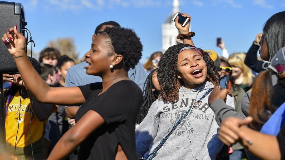 Concerned Student 1950 members celebrated on Monday near Traditions Plaza on the University of Missouri campus. Earlier Monday, Tim Wolfe, the president of the Missouri system, resigned from his position.