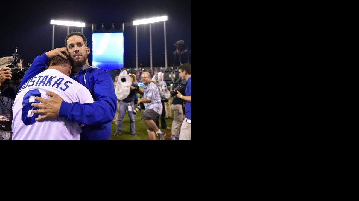 Royals starting pitcher James Shields hugged third baseman Mike Moustakas after the Royals defeated the A's in Tuesday's wild card playoff baseball game at Kauffman Stadium.
