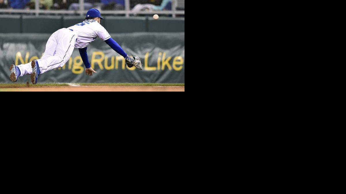 
Royals first baseman Eric Hosmer couldn’t reach a double by Boston Red Sox’s Jemile Weeks in the third inning of Friday’s game.
