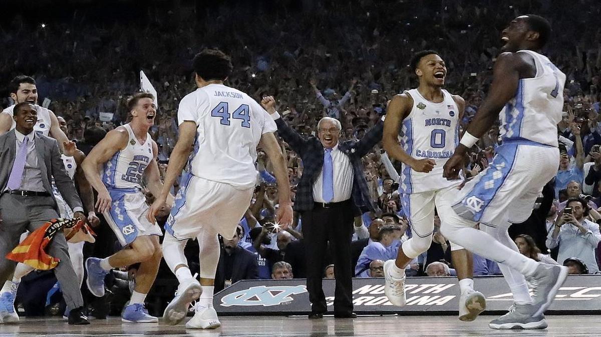 North Carolina coach Roy Williams and players celebrate after winning the NCAA championship game over Gonzaga on Monday, April 3, 2017, in Glendale, Ariz.