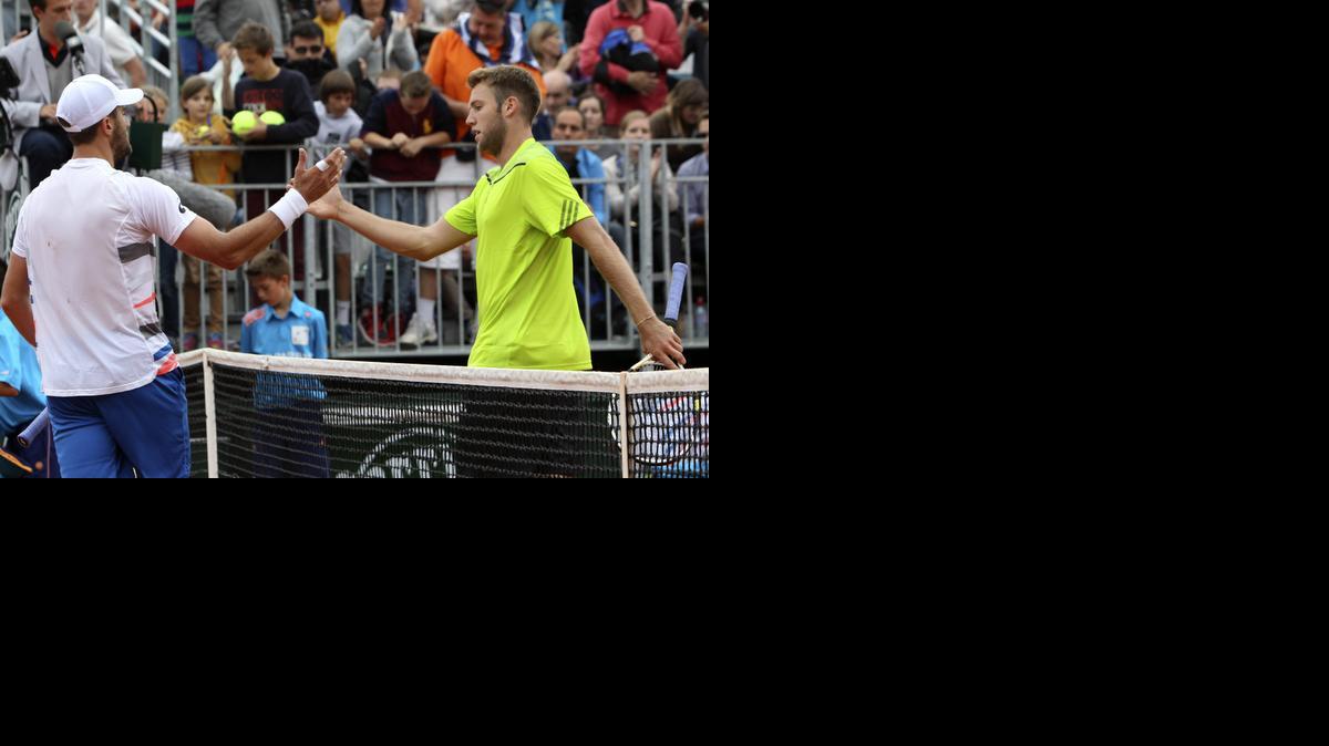 
Blue Valley North product Jack Sock, right, shakes hands with with Steve Johnson after their second-round match at the French Open on Thursday.
