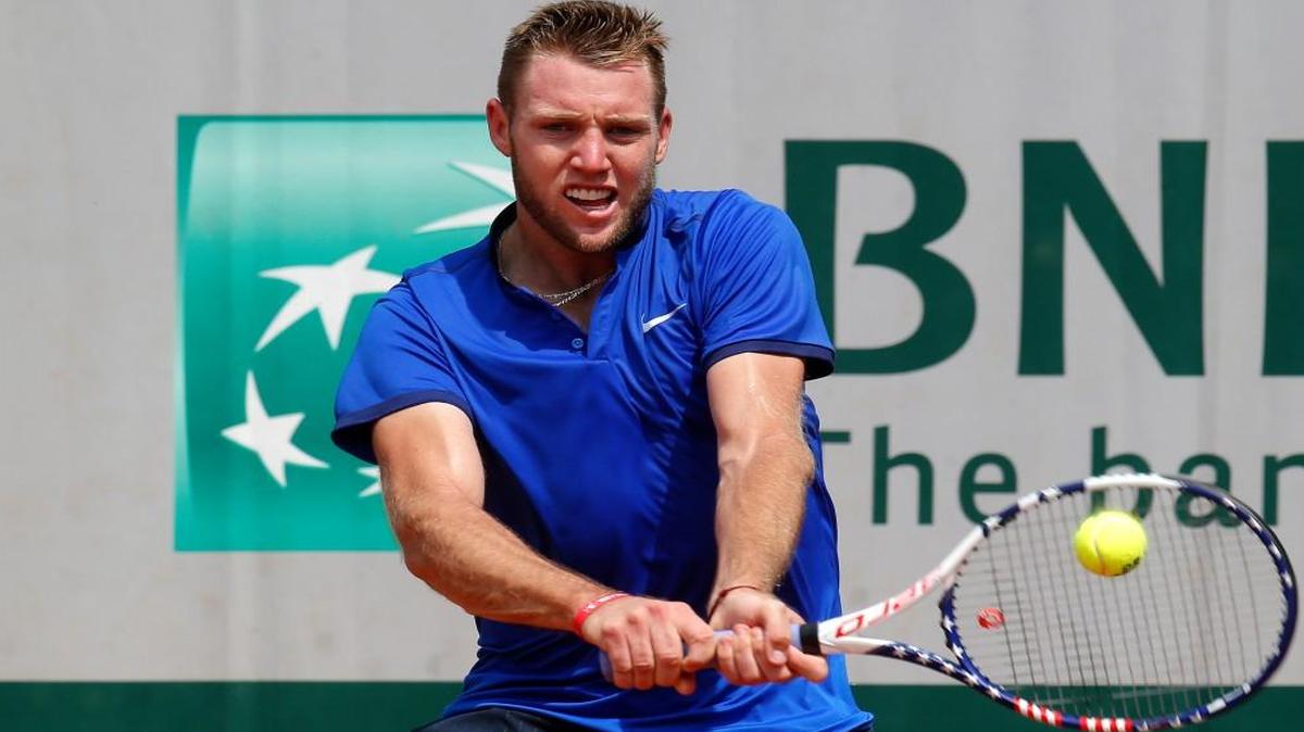 Jack Sock returns the ball to Spain’s Albert Ramos-Vinolas during their third-round match at Roland Garros.