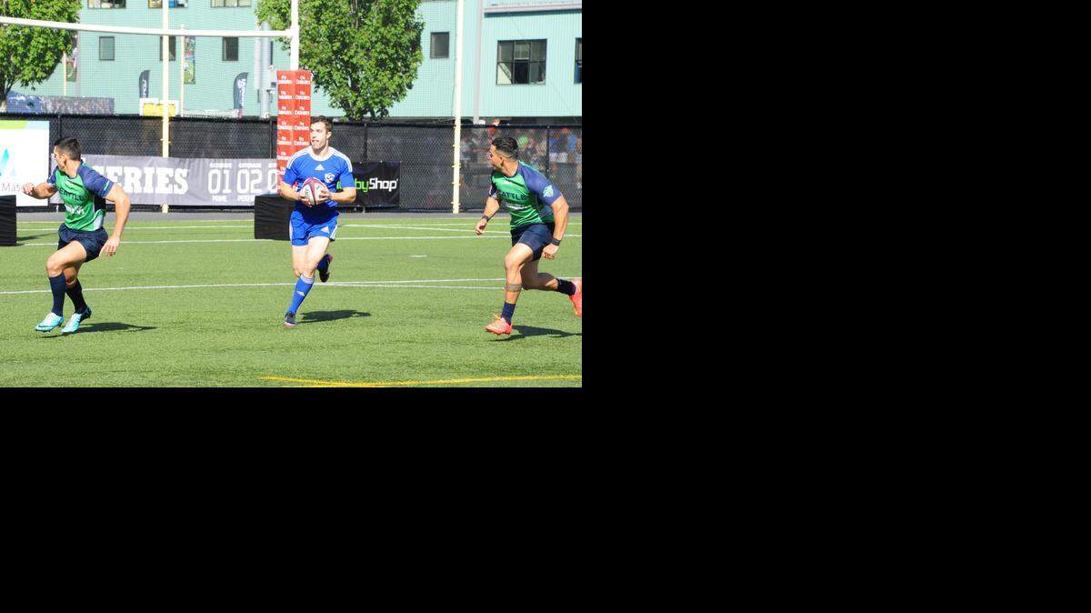 
Ed Mills (with ball) of the Kansas City Blues Rugby Club looks for an opening against the Seattle Saracens last weekend at the USA Rugby Emirates Airlines 7s National Championships in Tukwila, Wash.
