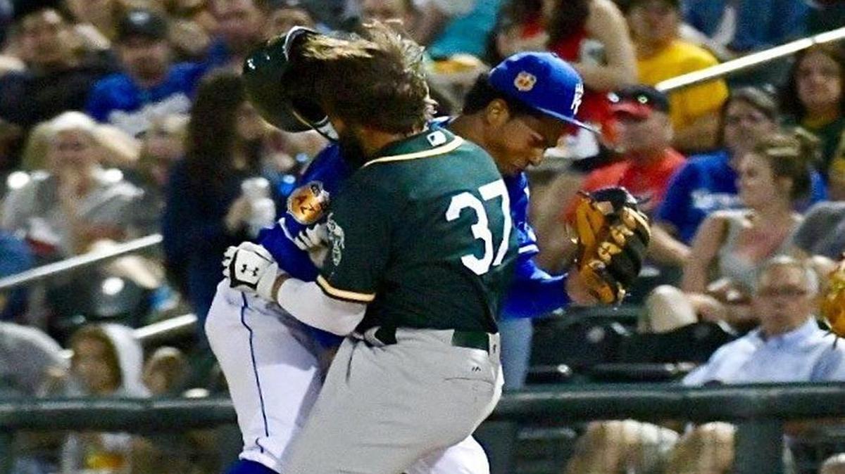 Kansas City Royals second baseman Raul Mondesi and Jaff Decker of the Oakland A’s collided at first base in the seventh inning of Friday’s spring-training game in Surprise, Ariz. Both left the game after being helped to their feet.