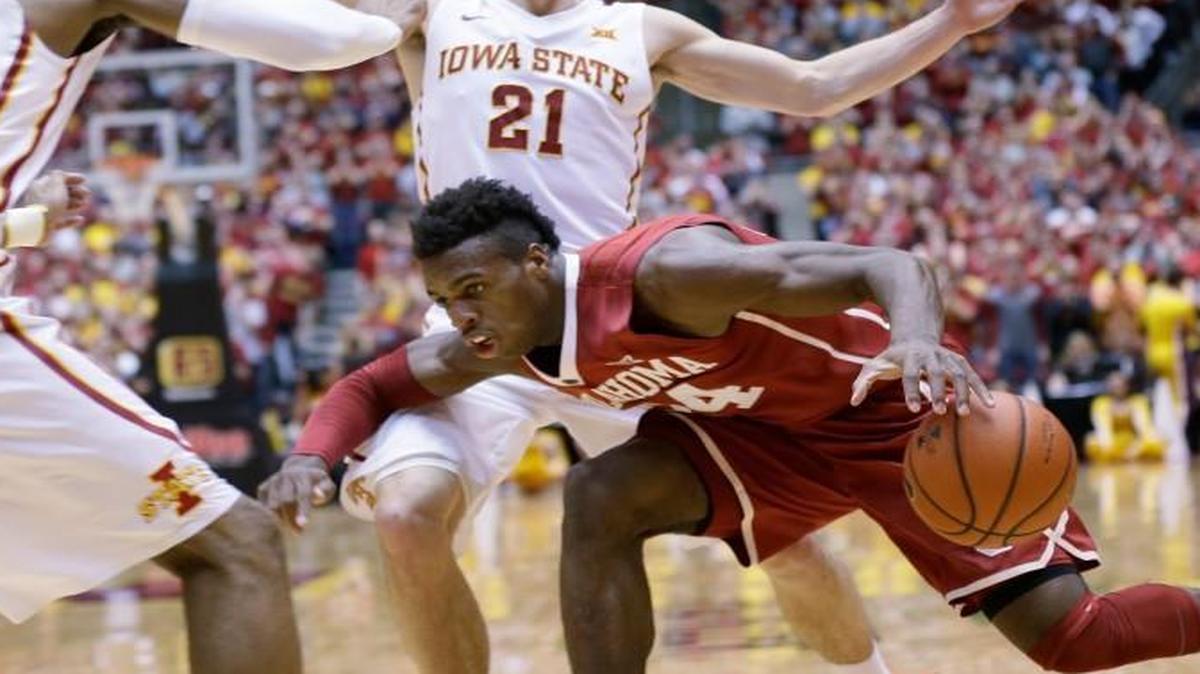 Oklahoma guard Buddy Hield (right) lost the ball while driving to the basket between Iowa State’s Monte Morris (left) and Matt Thomas during Monday’s game in Ames, Iowa.