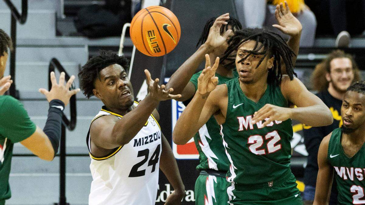 Missouri’s Kobe Brown, left, and Mississippi Valley State’s Michael Barber, right, battle for a loose ball during the first half on Sunday, Nov. 20, 2022, in Columbia, Mo.