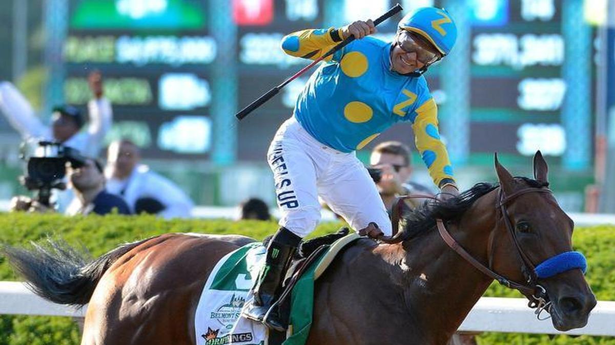 
After winning the Kentucky Debry and Preakness, American Pharoah came through with a victory Saturday in the Belmont Stakes and became the first horse to win the Triple Crown since Affirmed in 1978. Jockey Victor Espinoza reacted after crossing the finish line aboard the winner. 
