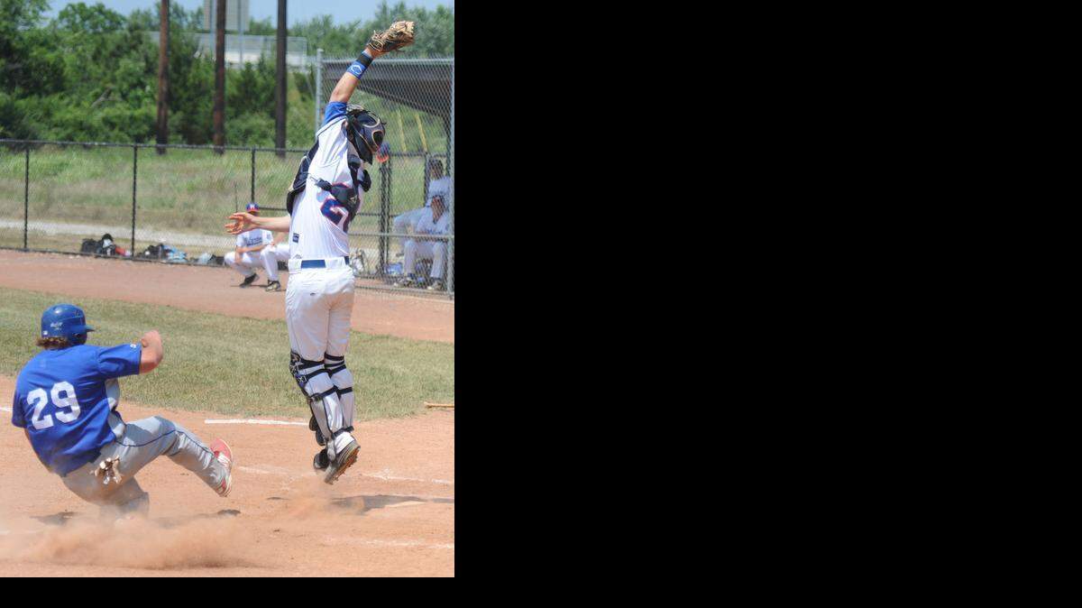 
Milgram catcher Billy Maloney leaps for the ball but is unable to prevent UMB’s Zach Anderson from scoring at the plate in a game on Sunday afternoon.
